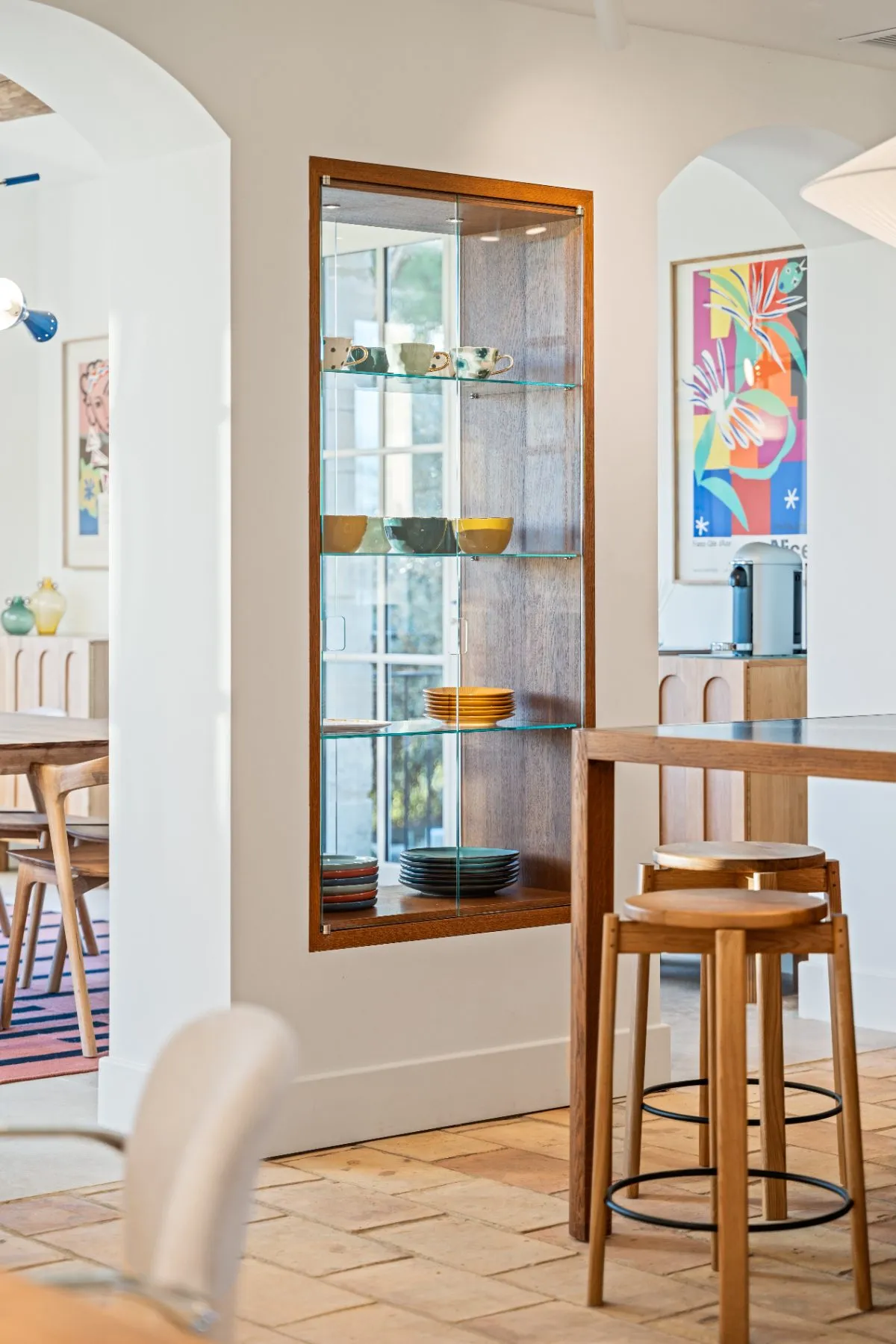 Between the kitchen and the dining room