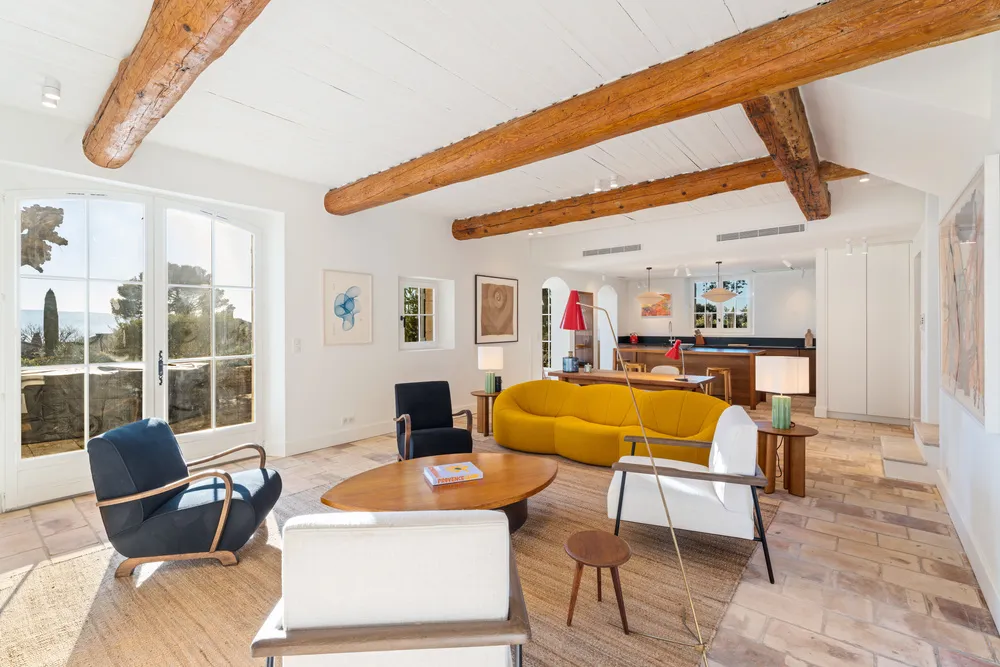Beamed living room with terracotta floor and garden doors